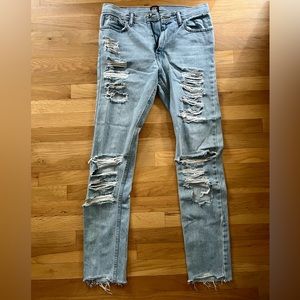 Skinny light washed ripped jeans from Urban Outfitters size 32x34